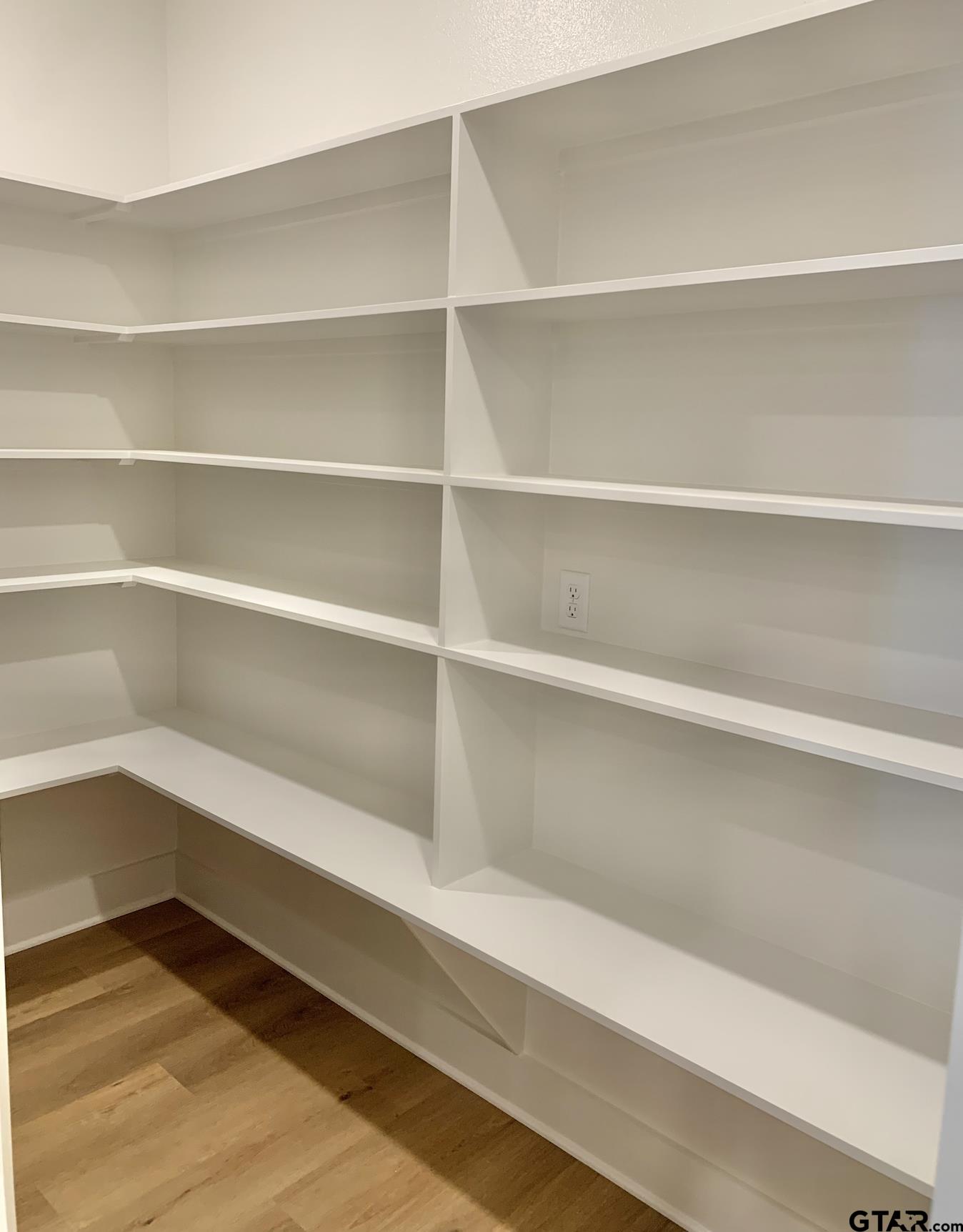 9115 Long Branch Tyler, TX 75703 - Photo 19 of 39 a view of walk in closet with empty racks