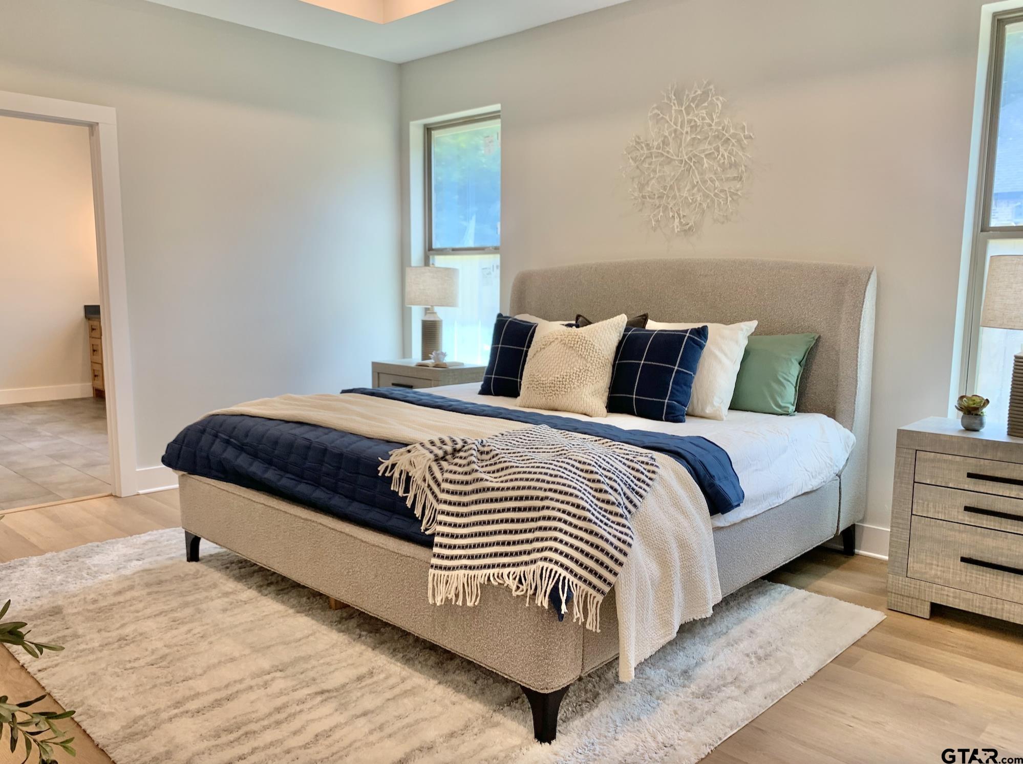 9115 Long Branch Tyler, TX 75703 - Photo 25 of 39 a bedroom with a bed and a night stand