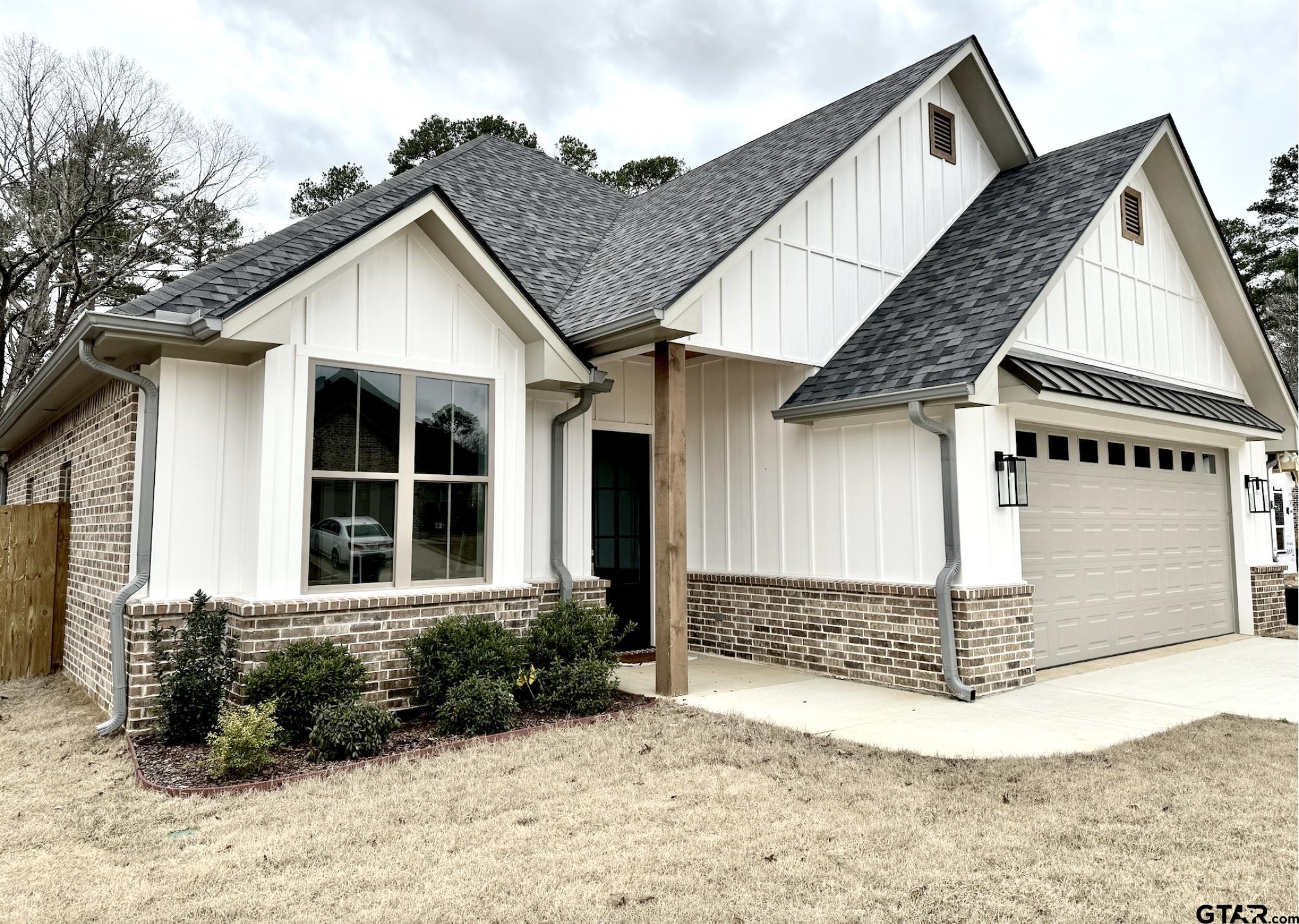 9115 Long Branch Tyler, TX 75703 - Photo 39 of 39 a front view of a house with a garden