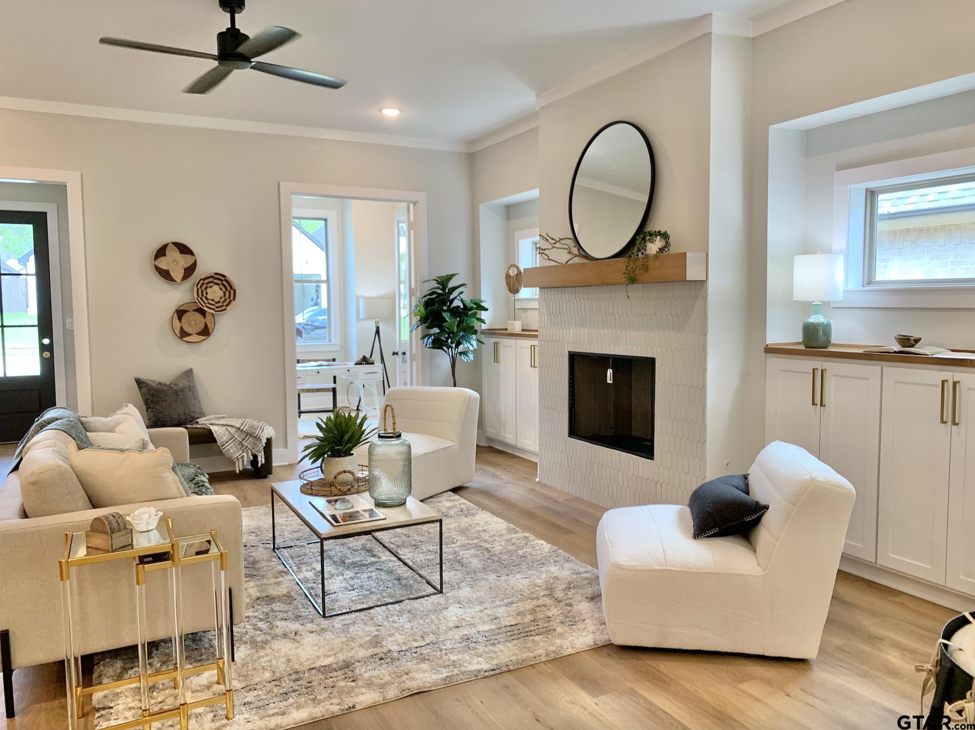 9115 Long Branch Tyler, TX 75703 - Photo 4 of 39 a living room with furniture a fireplace and a window