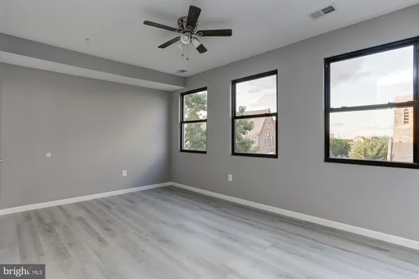 a view of empty room with windows