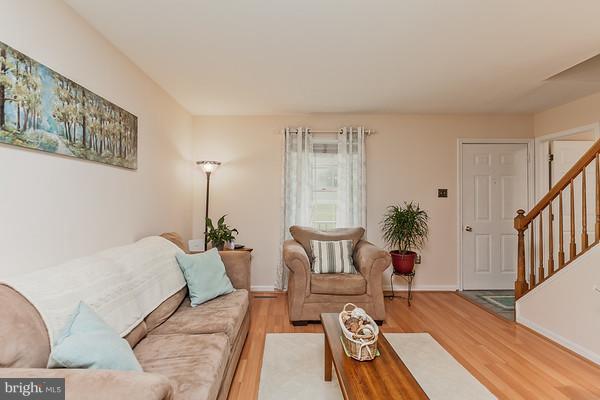Spacious living room with wood floors