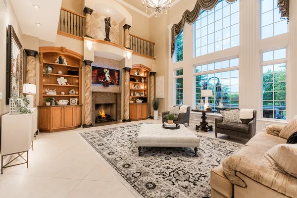a living room with lots of furniture and clutter