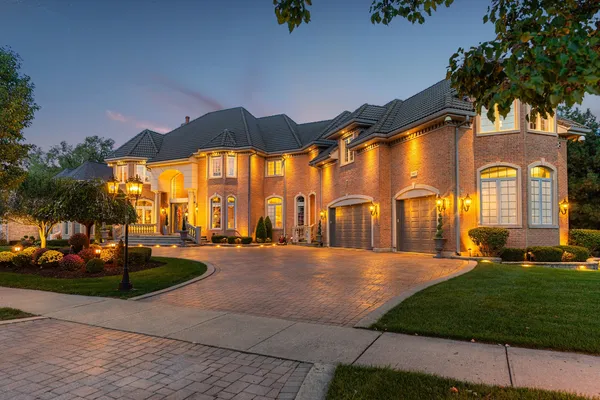 a front view of house with outdoor space and swimming pool