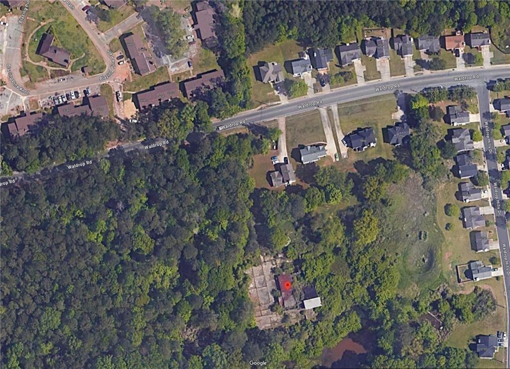an aerial view of a houses with outdoor space