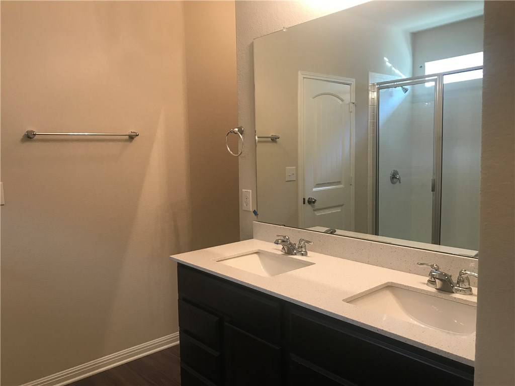 4313 Buffalo Ford Road Georgetown, TX 78628 - Photo 14 of 36 a bathroom with a sink and a mirror