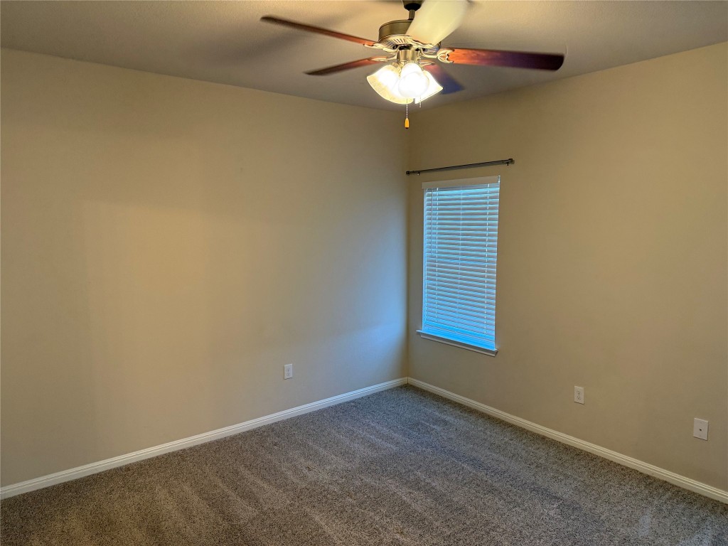 4313 Buffalo Ford Road Georgetown, TX 78628 - Photo 26 of 36 an empty room with a window and ceiling fan