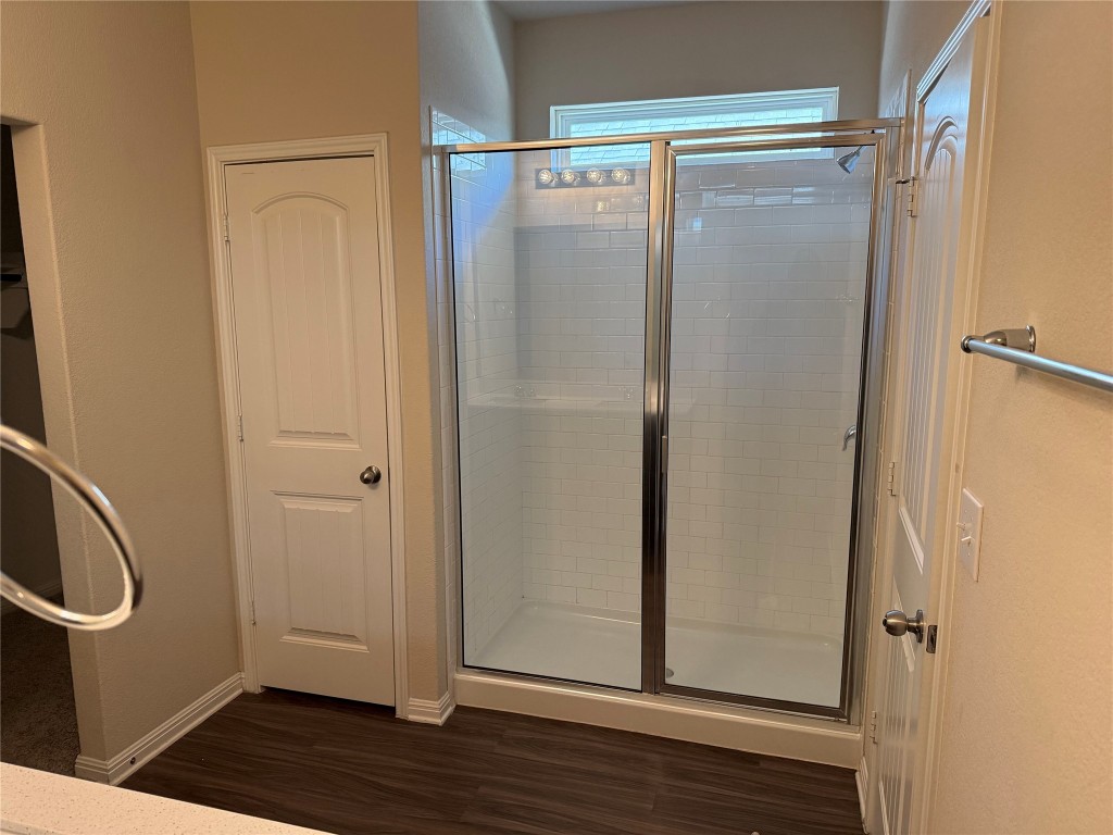 4313 Buffalo Ford Road Georgetown, TX 78628 - Photo 28 of 36 a view of a bathroom with wooden floor door