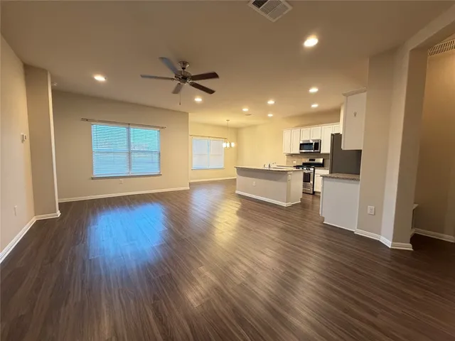 a view of a kitchen with a sink and a stove top oven