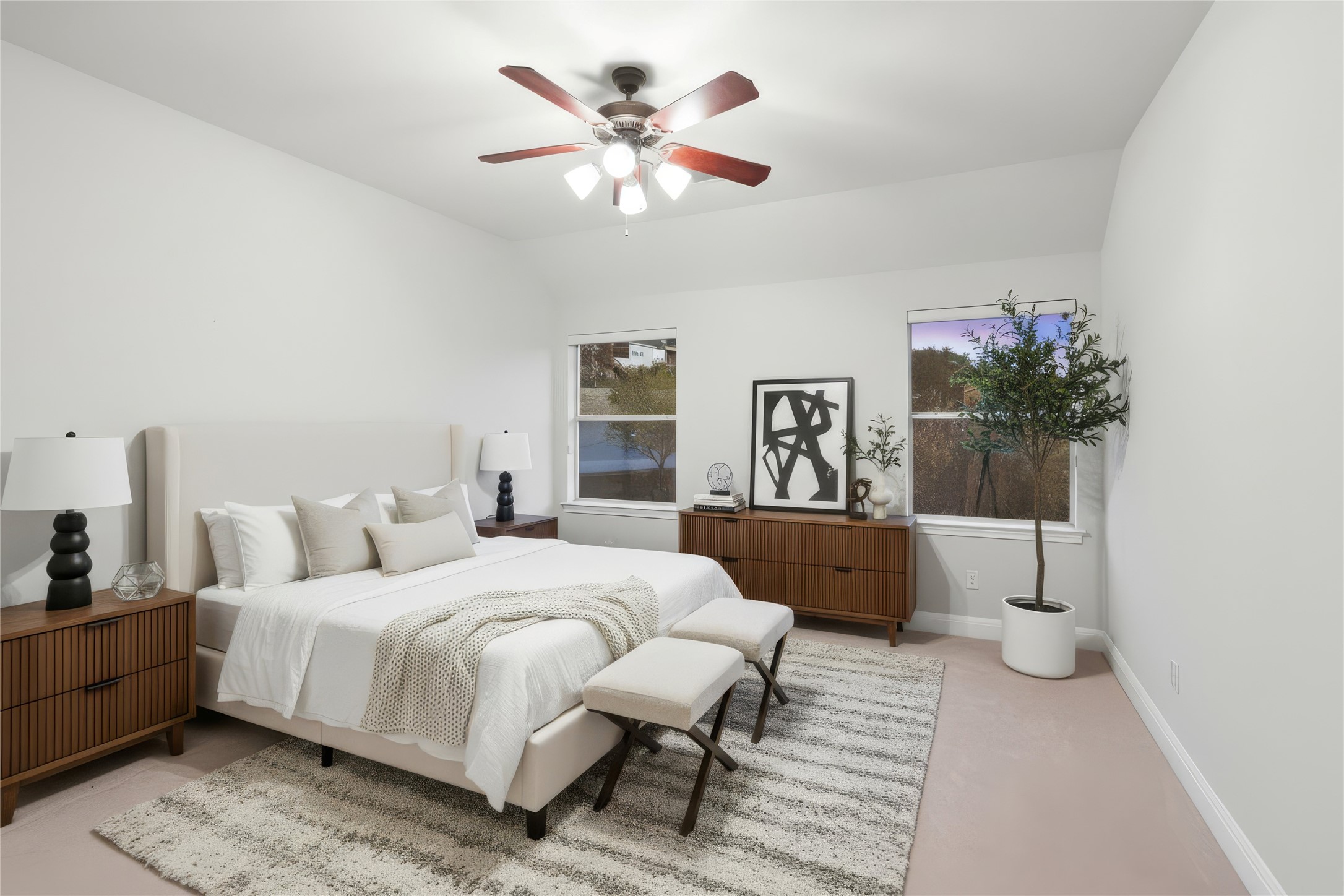 2906 Lakehurst Road Spicewood, TX 78669 - Photo 27 of 40 a bedroom with a large bed and a chandelier fan