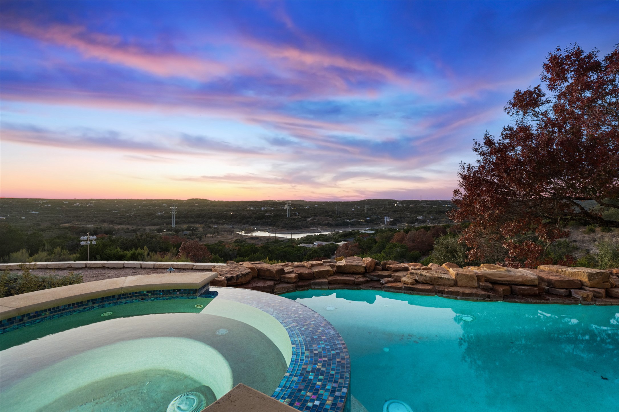 2906 Lakehurst Road Spicewood, TX 78669 - Photo 38 of 40 a view of a lake with houses