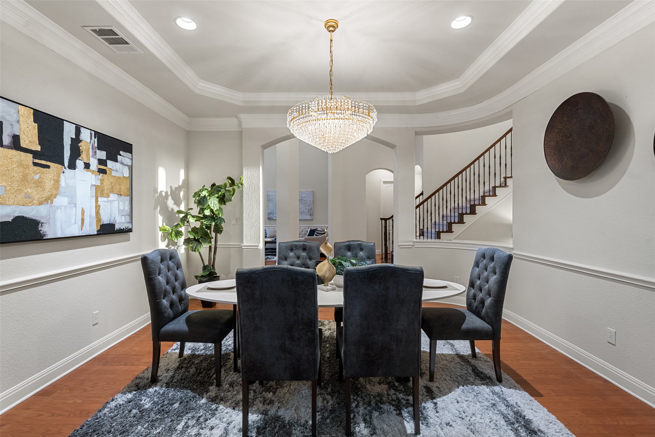 2906 Lakehurst Road Spicewood, TX 78669 - Photo 4 of 40 a view of a dining room with furniture and wooden floor