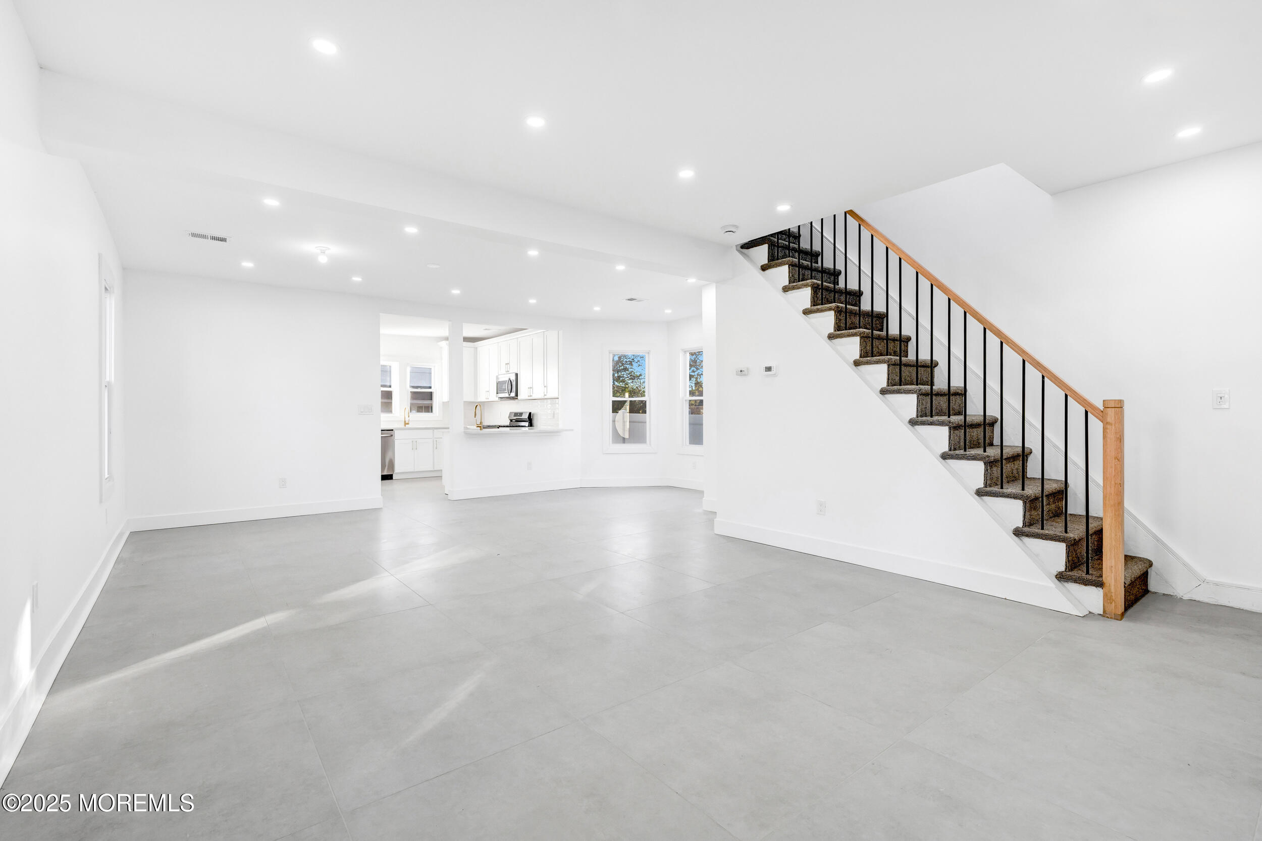 448 Monmouth Road West Long Branch, NJ 07764 - Photo 11 of 51 a view of a hallway with stairs and a couch