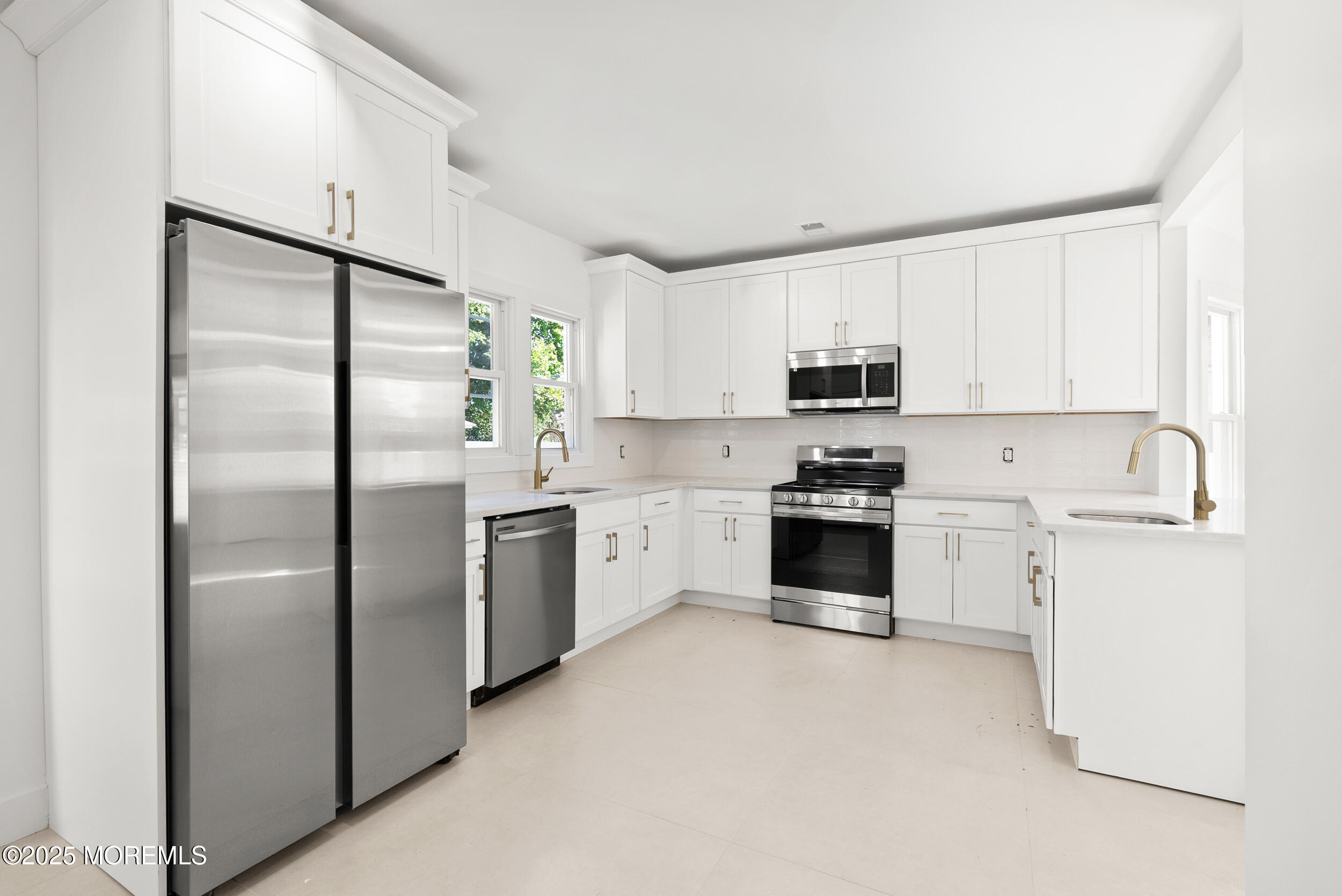 448 Monmouth Road West Long Branch, NJ 07764 - Photo 14 of 35 a kitchen with a refrigerator stove and microwave