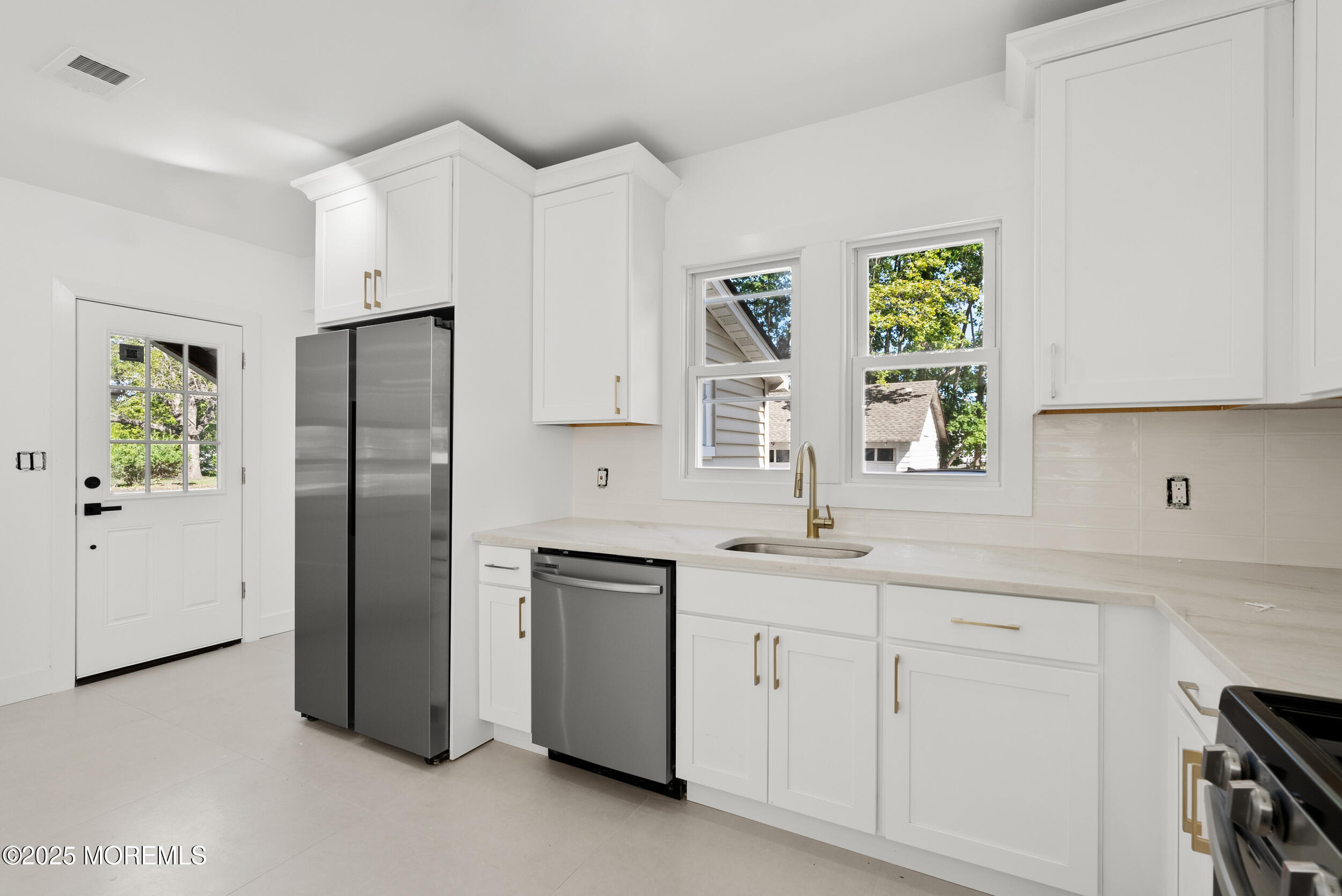 448 Monmouth Road West Long Branch, NJ 07764 - Photo 15 of 35 a kitchen with white cabinets and a window