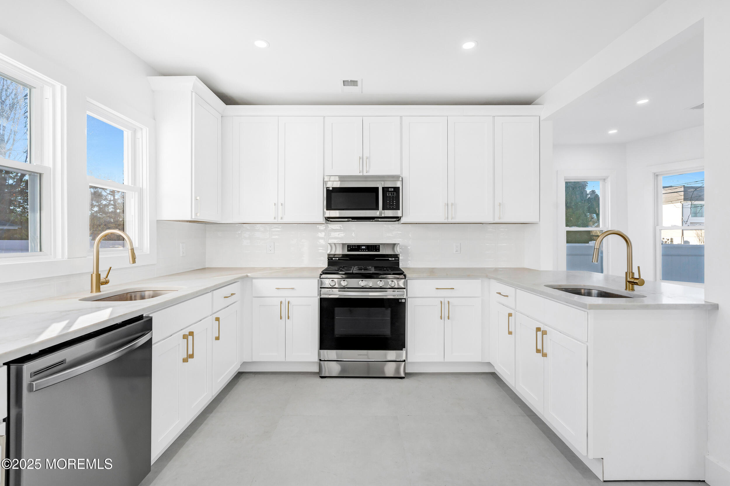 448 Monmouth Road West Long Branch, NJ 07764 - Photo 20 of 51 a kitchen with granite countertop white cabinets and stainless steel appliances