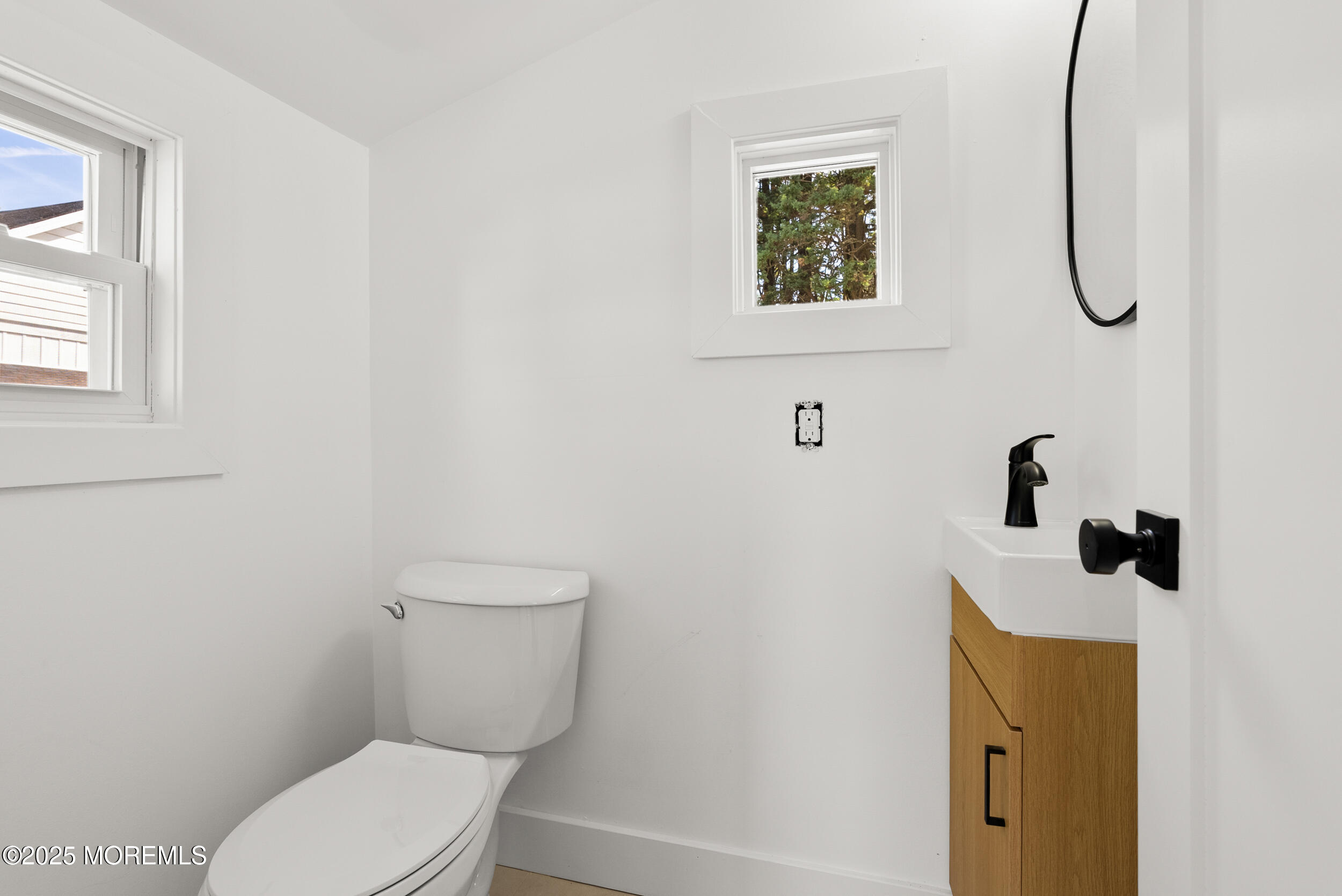 448 Monmouth Road West Long Branch, NJ 07764 - Photo 20 of 35 a bathroom with a toilet and a sink