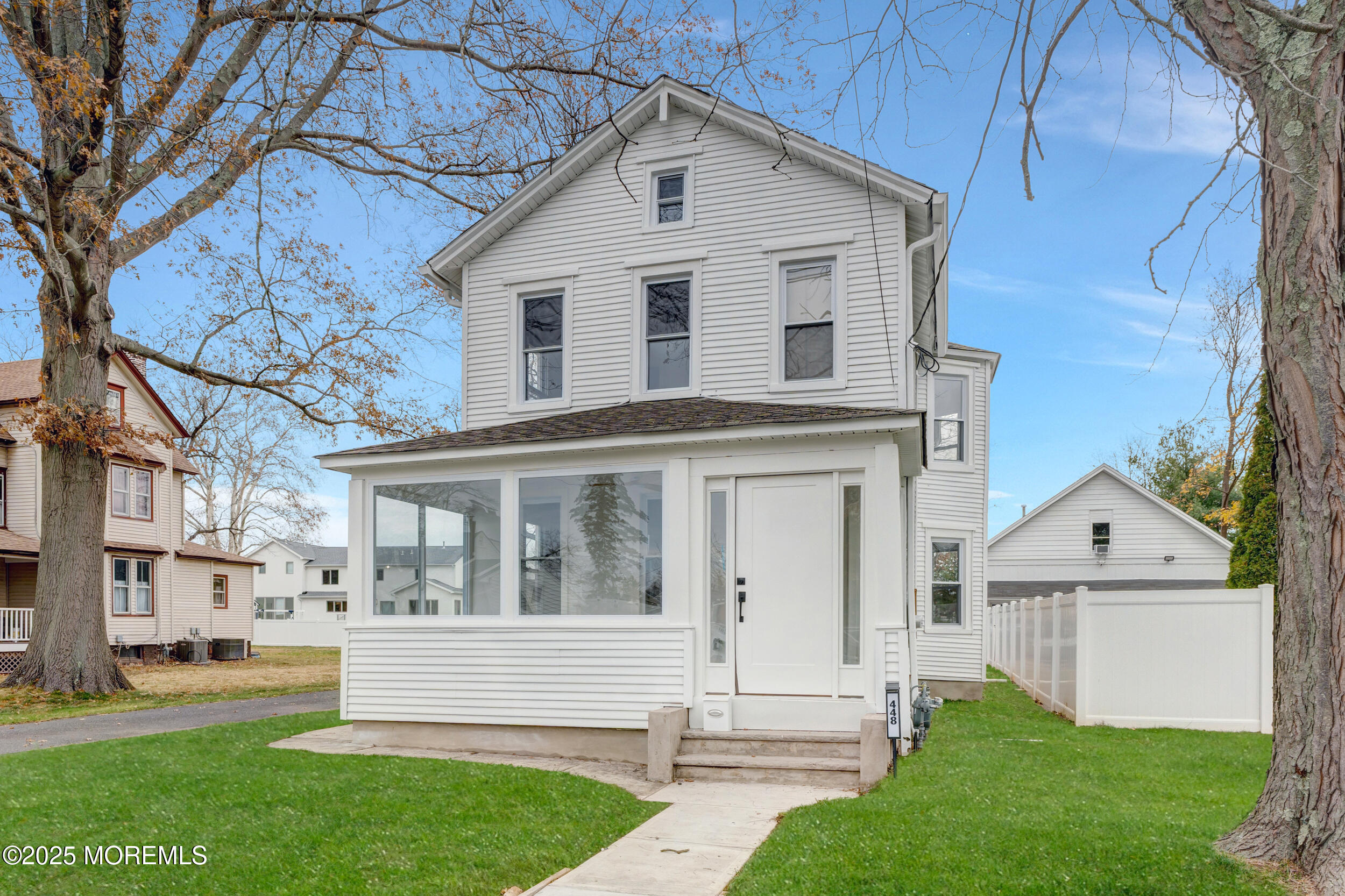 448 Monmouth Road West Long Branch, NJ 07764 - Photo 2 of 35 a front view of a house with a yard and porch