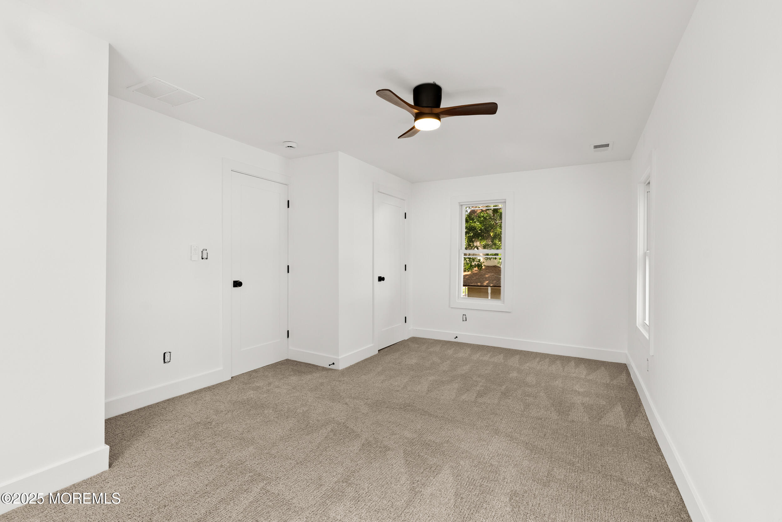 448 Monmouth Road West Long Branch, NJ 07764 - Photo 28 of 35 a view of room with hardwood ceiling fan