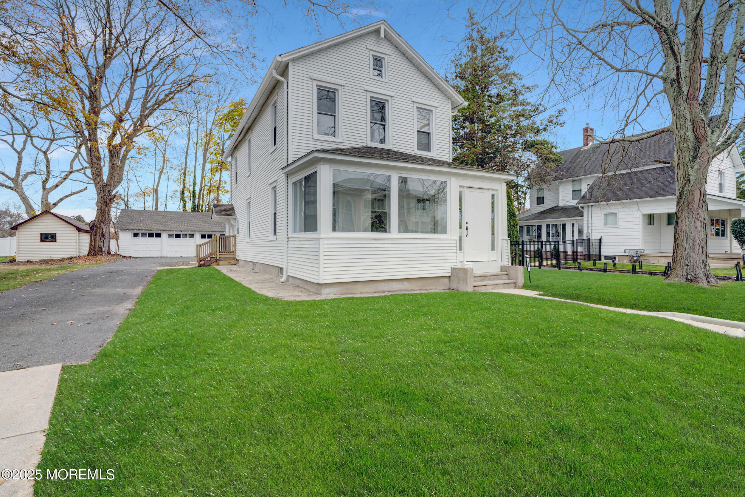 448 Monmouth Road West Long Branch, NJ 07764 - Photo 4 of 35 a front view of a house with a yard