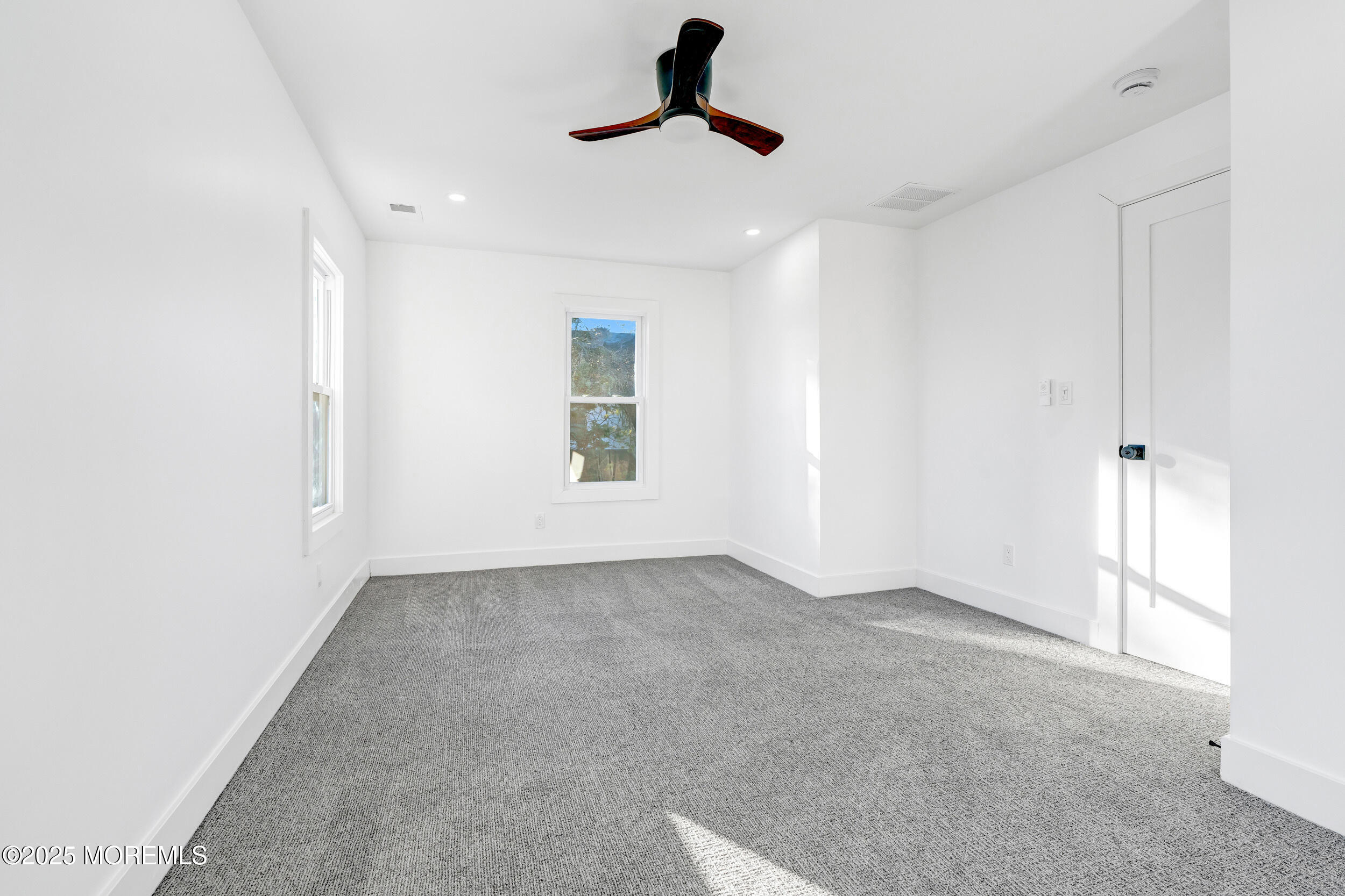 448 Monmouth Road West Long Branch, NJ 07764 - Photo 46 of 51 an empty room with windows and fan