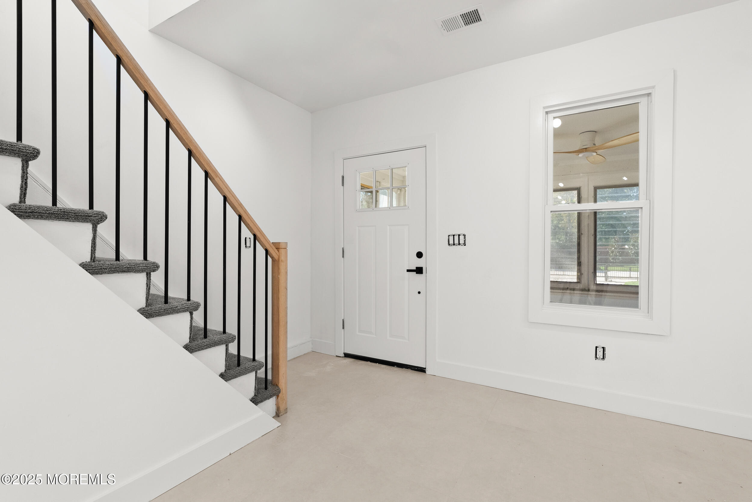 448 Monmouth Road West Long Branch, NJ 07764 - Photo 7 of 35 a view of an entryway with staircase