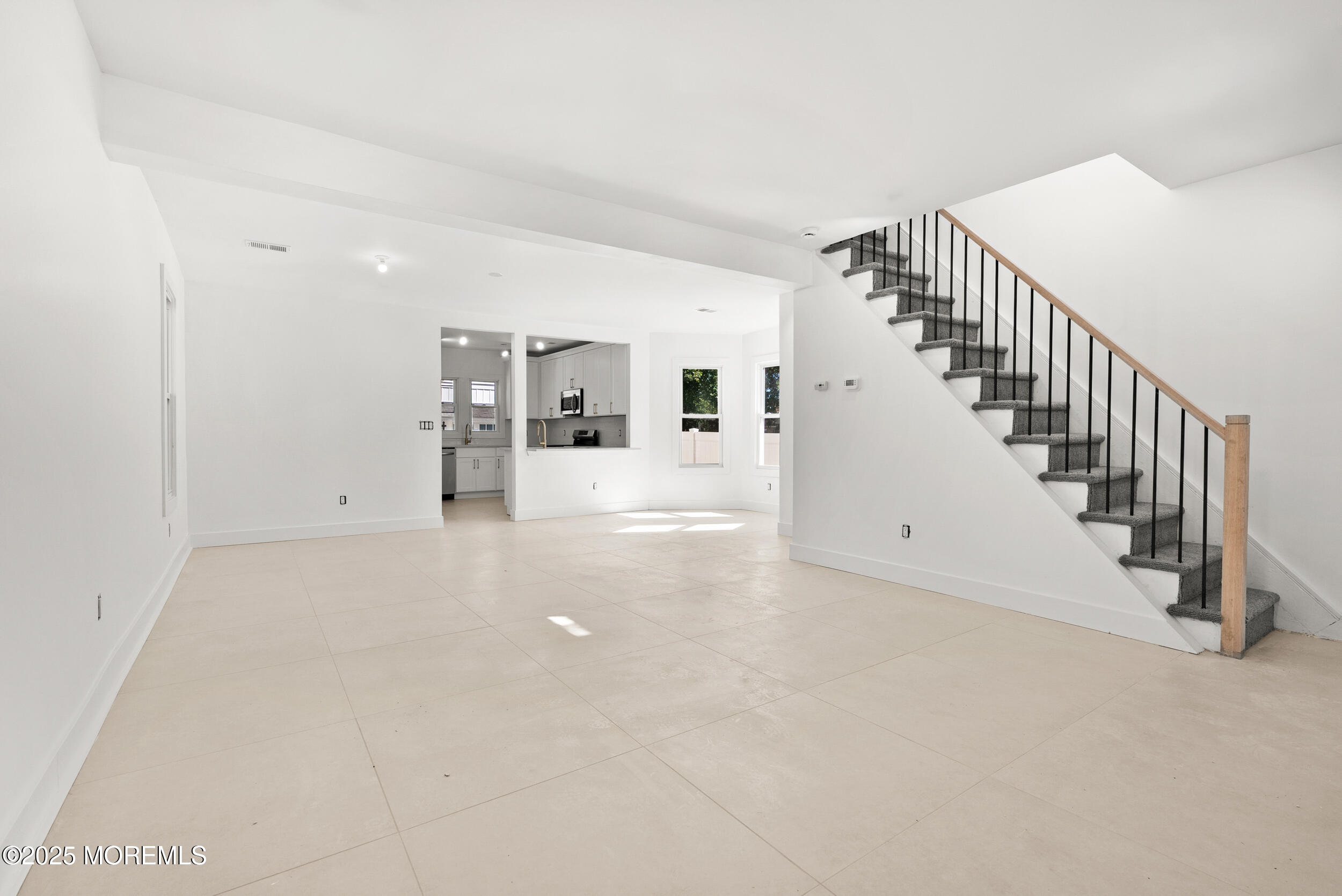 448 Monmouth Road West Long Branch, NJ 07764 - Photo 8 of 35 a view of a big room with staircase