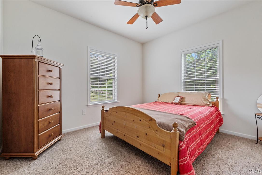 315 Bougher Hill Road Easton, PA 18042 - Photo 12 of 20 a bedroom with a bed and a chandelier