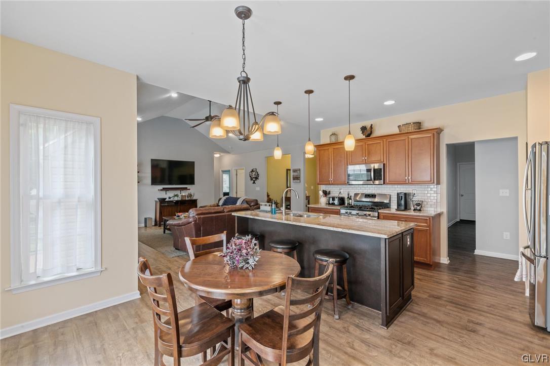 315 Bougher Hill Road Easton, PA 18042 - Photo 4 of 20 a view of a dining room and livingroom with furniture wooden floor a chandelier
