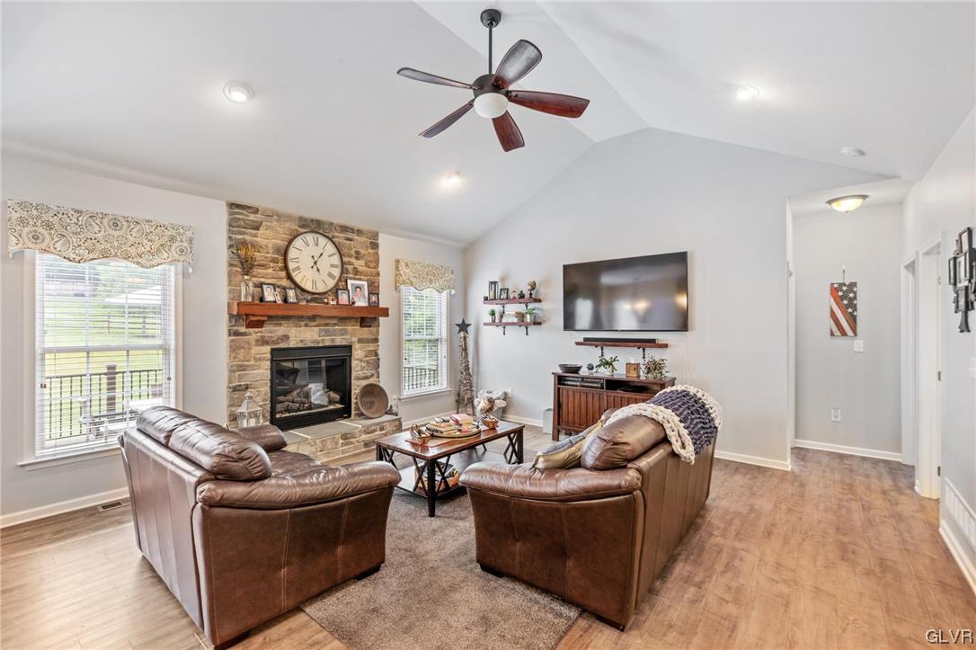 315 Bougher Hill Road Easton, PA 18042 - Photo 6 of 20 a living room with furniture a flat screen tv and a fireplace
