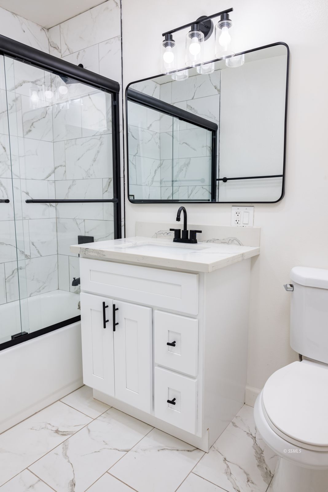 517 Vera Avenue Ridgecrest, CA 93555 - Photo 15 of 23 a bathroom with a sink toilet a mirror and window