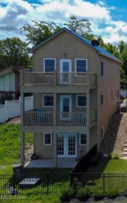 5919 Lake Road West, Unit 35 Ashtabula, OH 44004 - Photo 37 of 37 Rear view of house with a balcony and a fenced backyard