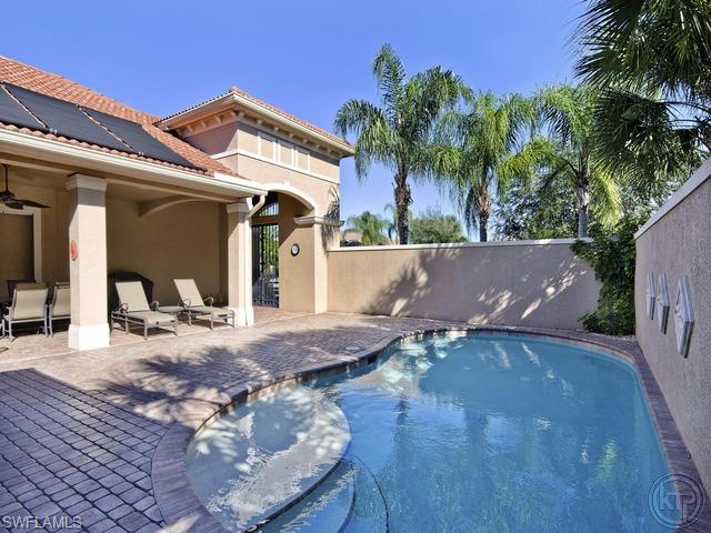 5066 Rustic Oaks Circle Naples, FL 34105 - Photo 2 of 12 a view of outdoor space with seating