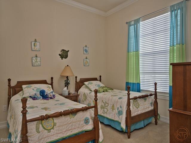 5066 Rustic Oaks Circle Naples, FL 34105 - Photo 10 of 12 a bedroom with two beds and window