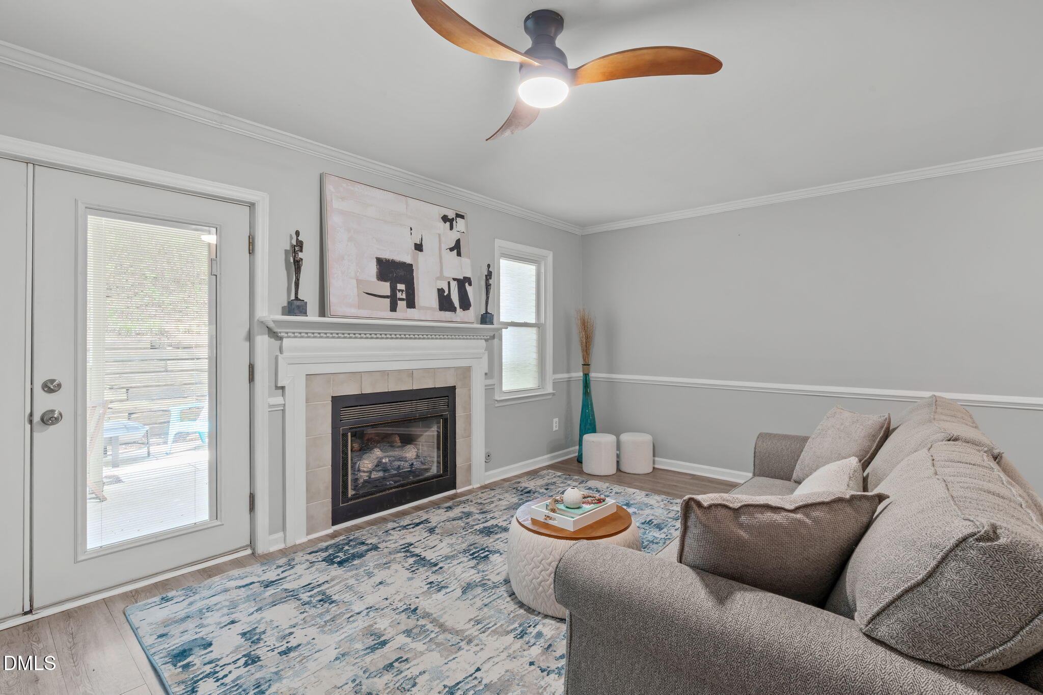 203 Oak Hollow Court Raleigh, NC 27613 - Photo 11 of 37 a living room with furniture and a fireplace