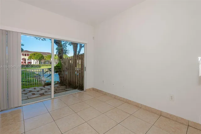 a kitchen with stainless steel appliances a stove sink and microwave