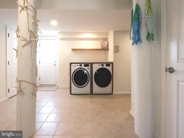 a living room with fireplace furniture and a flat screen tv