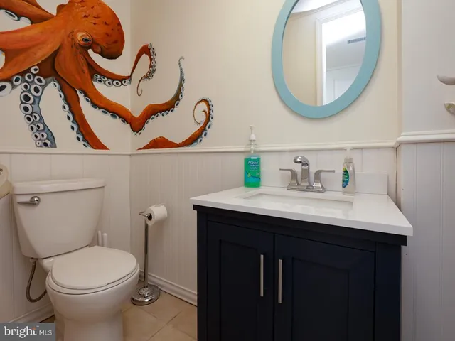 a kitchen with a stove sink and cabinets