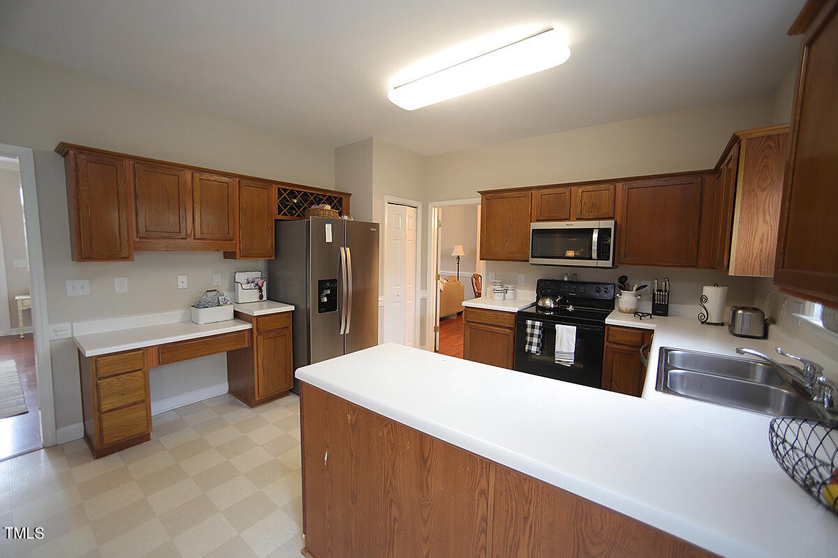3557 Dewing Drive Raleigh, NC 27616 - Photo 13 of 32 a large kitchen with cabinets