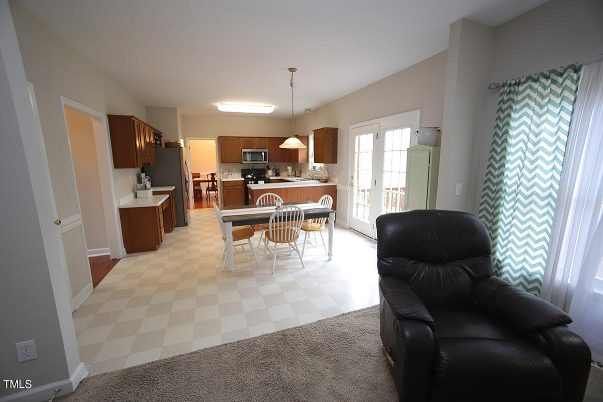 3557 Dewing Drive Raleigh, NC 27616 - Photo 15 of 32 a living room with furniture and a large window
