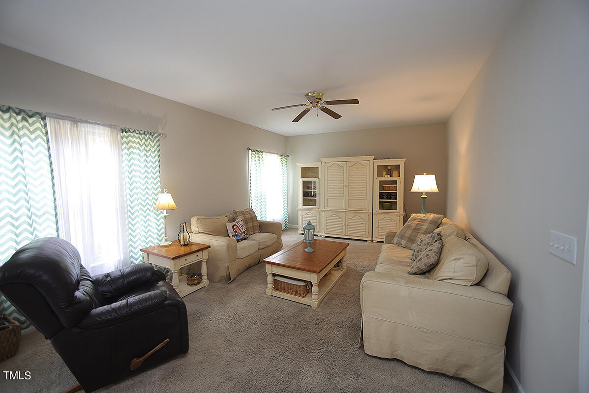 3557 Dewing Drive Raleigh, NC 27616 - Photo 17 of 32 a living room with furniture and windows