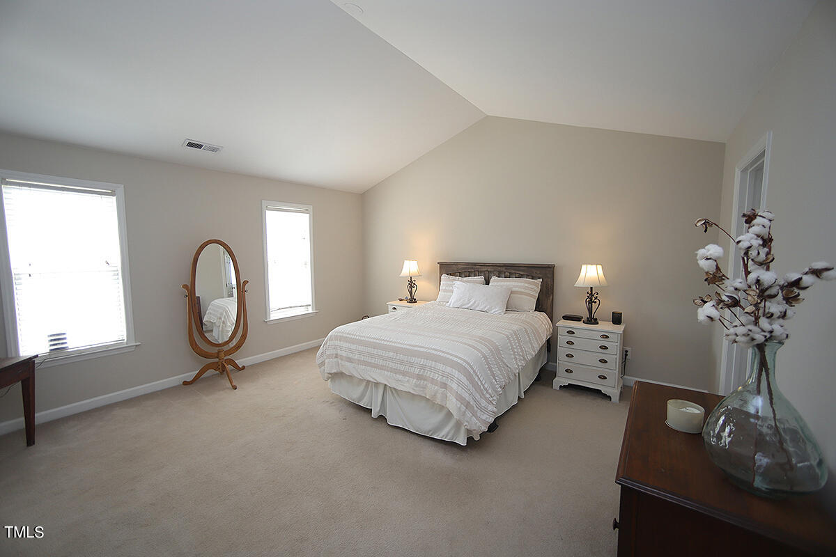 3557 Dewing Drive Raleigh, NC 27616 - Photo 18 of 32 a bedroom with bed and a table