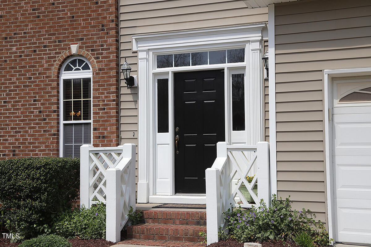 3557 Dewing Drive Raleigh, NC 27616 - Photo 2 of 32 a front view of a house with a garden