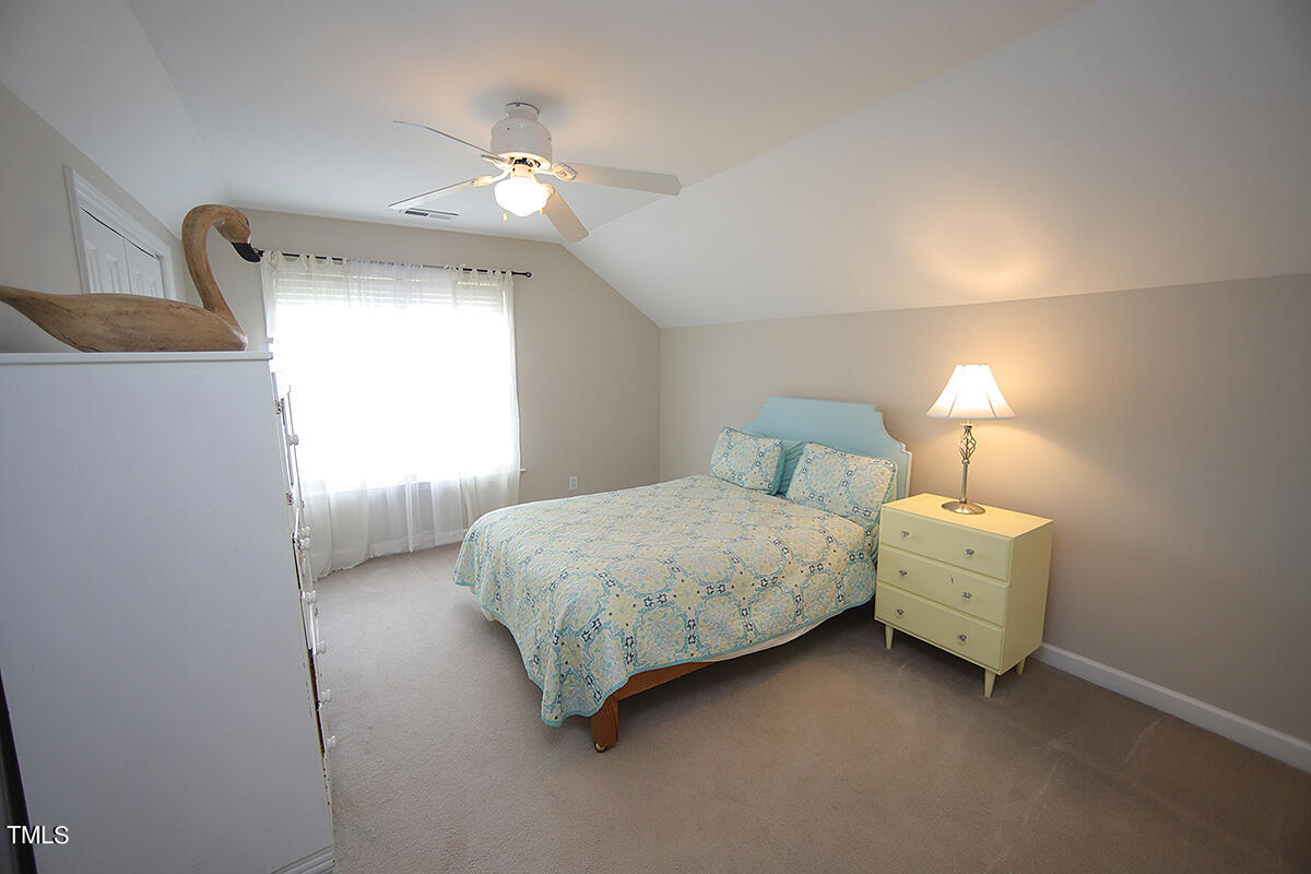 3557 Dewing Drive Raleigh, NC 27616 - Photo 26 of 32 a bedroom with a bed and a window