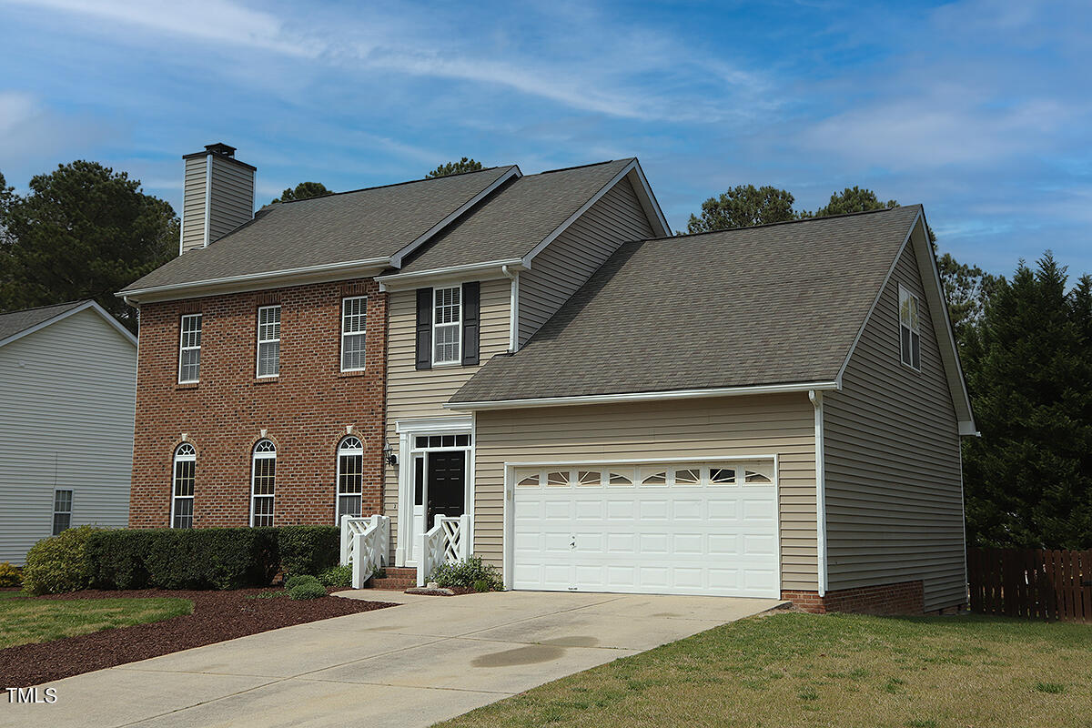 3557 Dewing Drive Raleigh, NC 27616 - Photo 3 of 32 a front view of a house with a yard