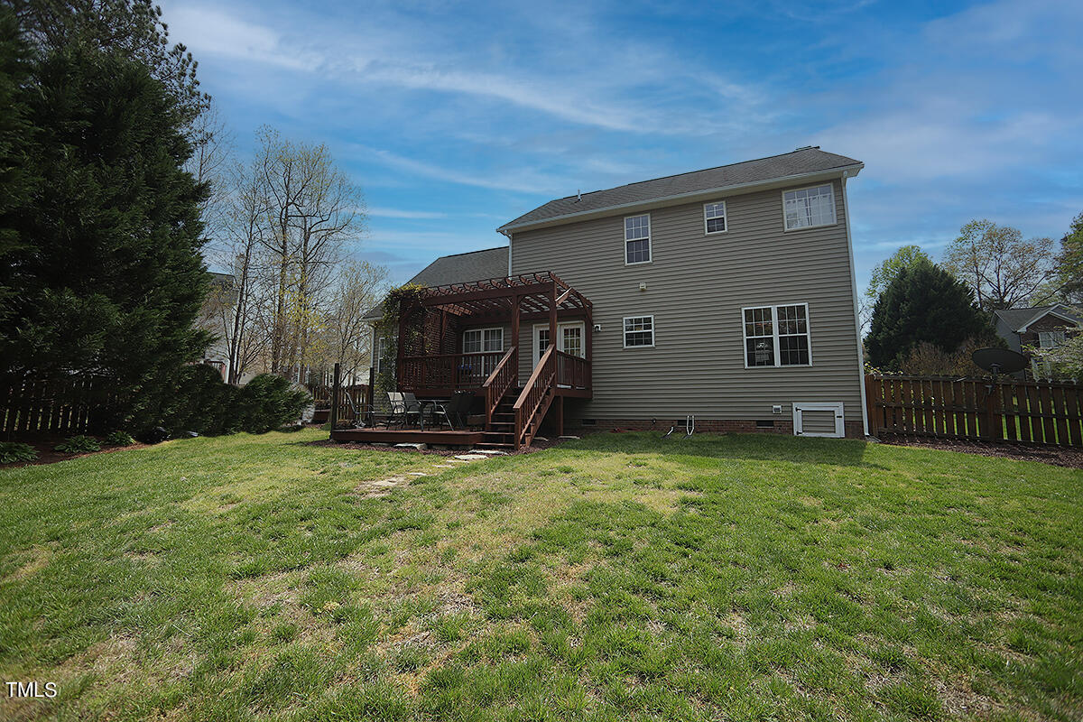 3557 Dewing Drive Raleigh, NC 27616 - Photo 31 of 32 a view of a house with backyard and a tree