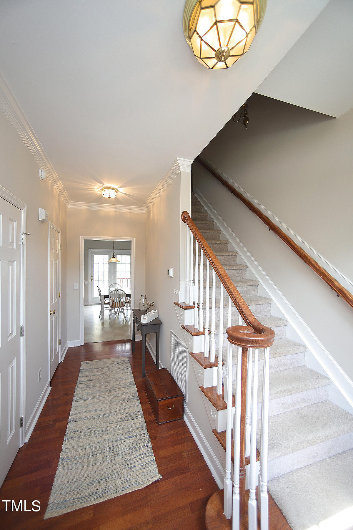3557 Dewing Drive Raleigh, NC 27616 - Photo 4 of 32 a view of entryway and hall with wooden floor