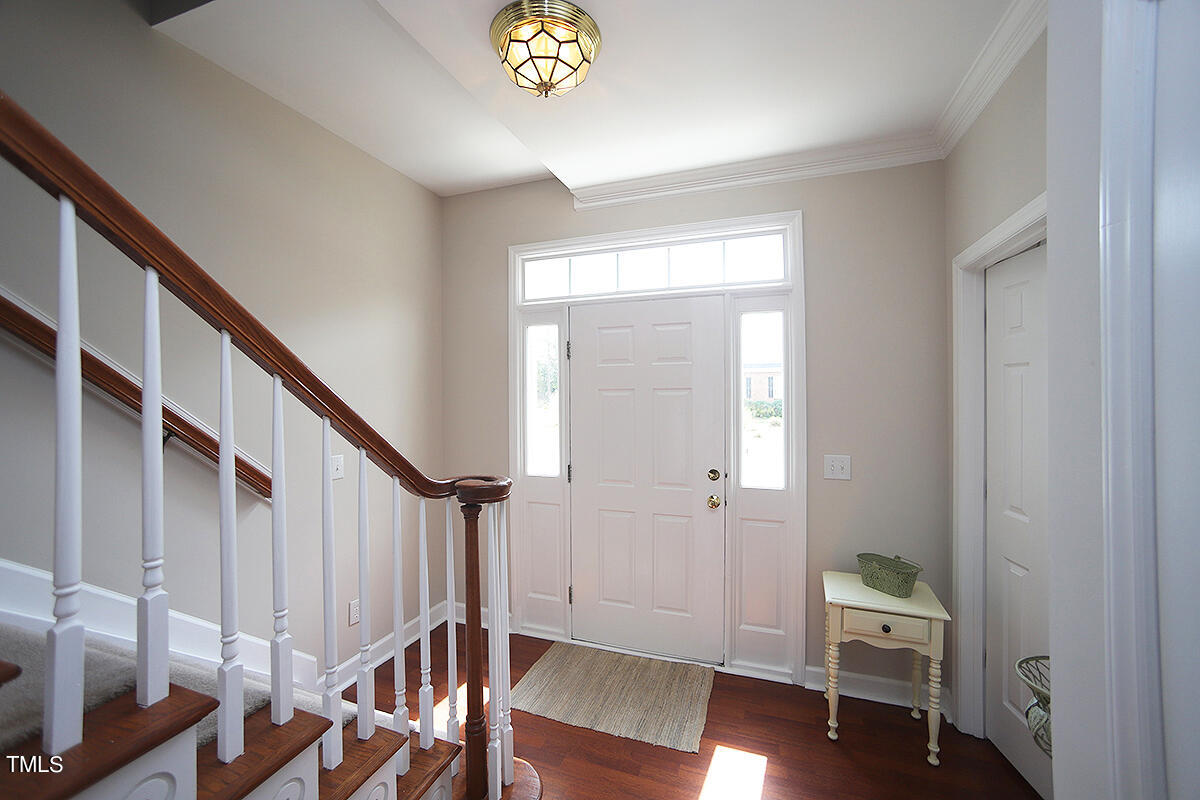 3557 Dewing Drive Raleigh, NC 27616 - Photo 5 of 32 a view of an entryway with wooden floor and stairs