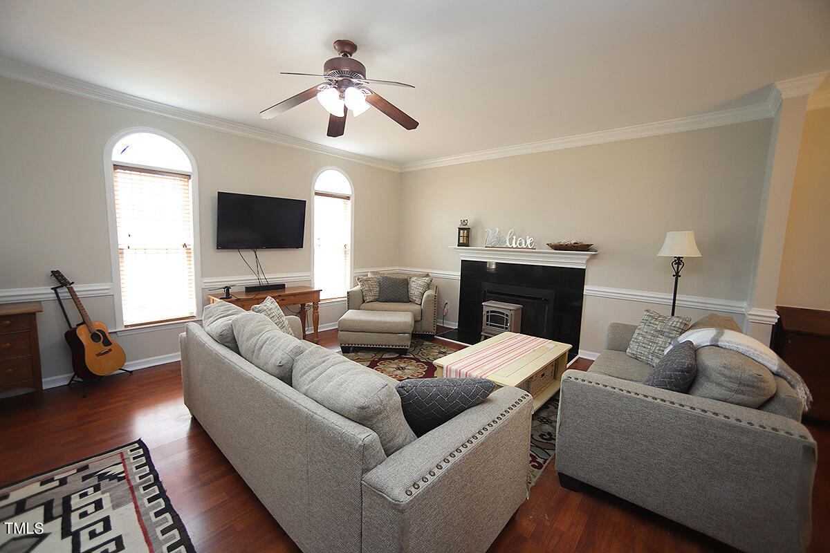 3557 Dewing Drive Raleigh, NC 27616 - Photo 7 of 32 a living room with furniture and a flat screen tv