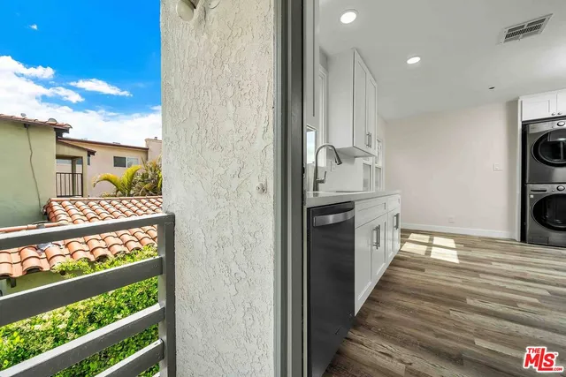 a view of a storage and utility room with washer and dryer
